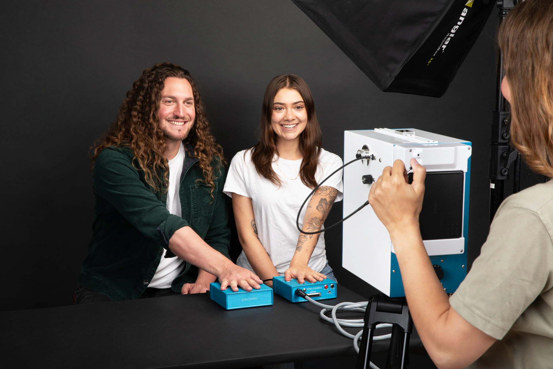 Aura Camera 6000 in action - two people using the aura camera equipment