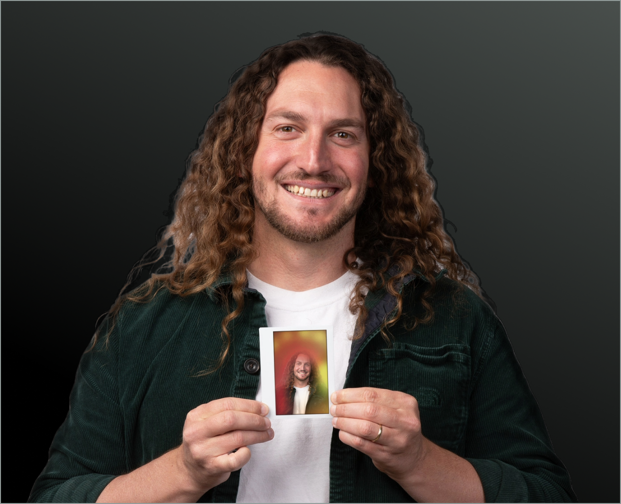 Person holding an instant-film aura portrait